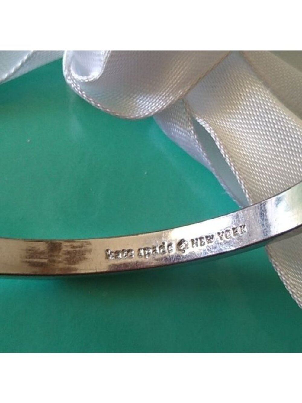 Kate Spade New York Take A Bow Bangle Bracelet, Silver, 2 3/8" opening - Picture 7 of 7